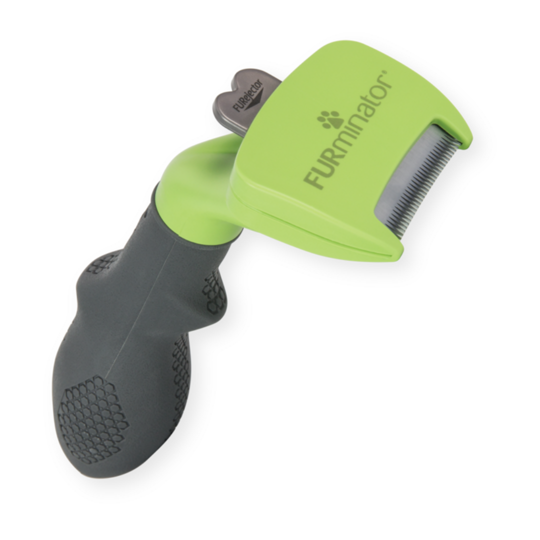 Outil FURminator S anti-mue pour chiens à poils longs, vue en perspective avec manche antidérapant