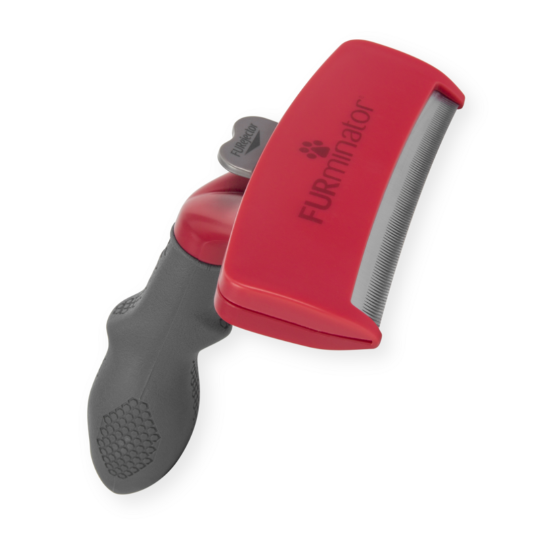 Outil FURminator XL anti-mue pour chiens à poils longs, vue en perspective avec manche antidérapant