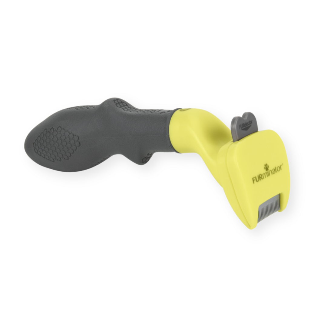 Outil FURminator XS poils longs pour chiens de race miniature, vue de côté avec manche ergonomique et lame en acier inoxydable