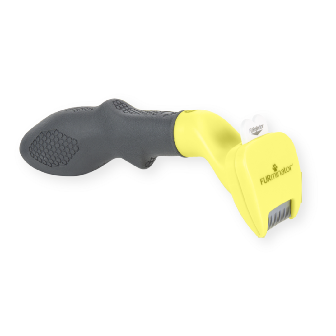 Outil FURminator XS poils courts pour chiens, vue de côté avec manche ergonomique et lame en acier inoxydable