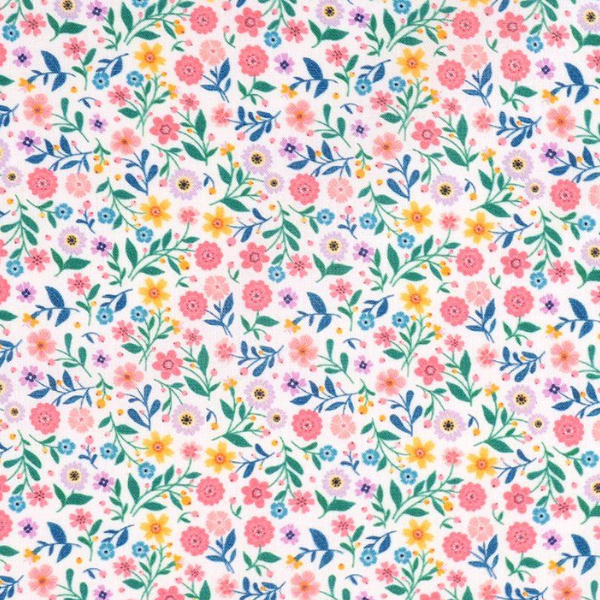 Tissu champêtre avec fleurs colorées et feuillage vert sur fond blanc